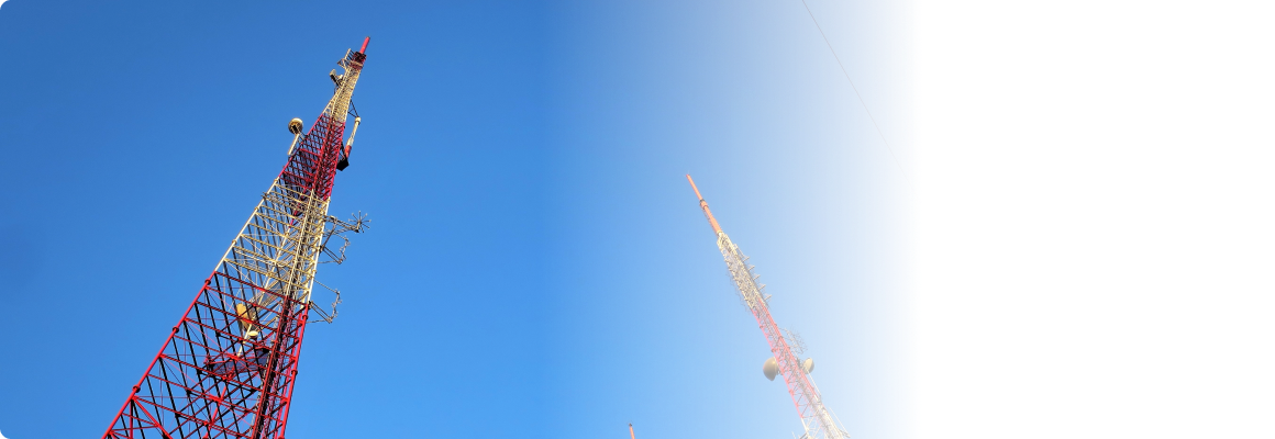 Telecommunication Towers/Masts rising high to the blue and clear sky.